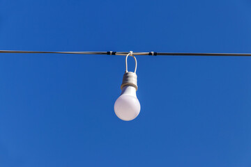 LED light blub in row on blue sky background