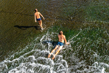 Swimming boys. Augustow Canal. Grodno Region, Belarus