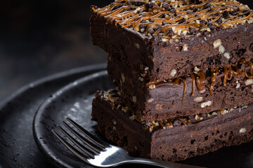 Dark Chocolate Brownies Stacked on a Plate