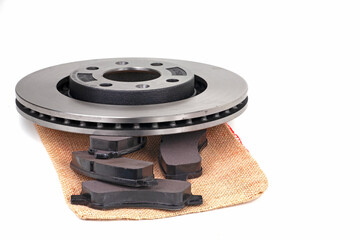  Brake discs and brake pads isolated on white. Auto parts