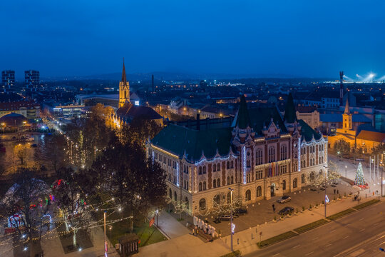 &Uacute;jpest, Budapest, Hungary - Aerial view of city hall of Ujpest with Queen of Heaven church and Christmas lights. Blue hour cityscape. &Uacute;jpest v&aacute;rosh&aacute;za.