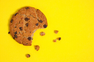 Chocolate chip cookies with chocolate chips on a yellow background.
