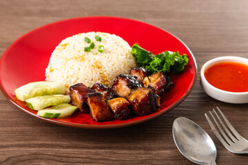 Chinese Sweet Bbq Pork is marinated in a sweet BBQ sauce and served with white rice.