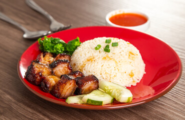 Chinese Sweet Bbq Pork is marinated in a sweet BBQ sauce and served with white rice.