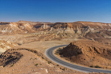 Fototapeta na wymiar Road across Zin Valley in the Negev Desert in Israel. Top view