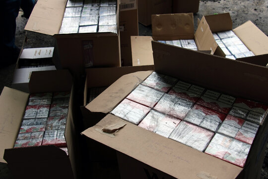 Shegini, Ukraine - Marh, 2017: Close-up of smuggled cigarettes packs, which were specially disguised as charcoal briquettes and transported to Europe across the Ukrainian-Polish border