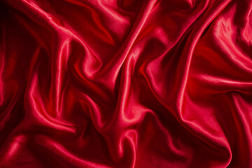 Luxurious satin red silk or fabric. soft waves cloth abstract background.