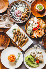 delicious European and Slavic cuisine on the big table waiting for guests. table with food, top view