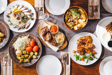 delicious European and Slavic cuisine on the big table waiting for guests. table with food, top view