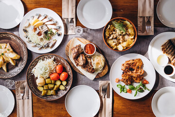 delicious European and Slavic cuisine on the big table waiting for guests. table with food, top view