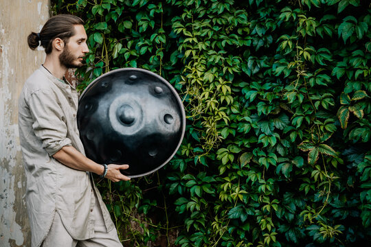 handpan in the hands of a musician. Music background for alternative contemporary music for meditation and relaxation