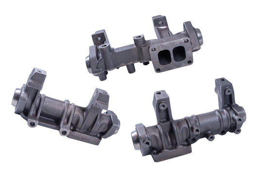 new exhaust manifold of the KAMAZ car, on a white background. The front part of the exhaust system of the internal combustion engine exhaust gas.