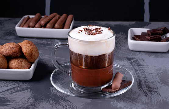 Bicerin, layered Italian coffee drink with chocolate and whipped cream in the glass