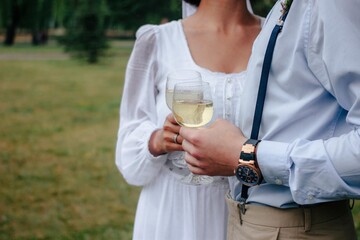 bride and groom drinking wine