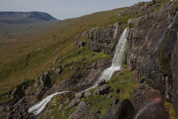 Beautiful cascade waterfall Bleiksarfoss in Eskifjordur, east of Iceland
