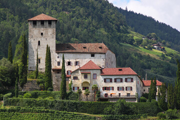 Fototapeta na wymiar Old medieval Lebenberg Castle on a mountain slope in the village of Tscherms near Merano, South Tyrol in Italy