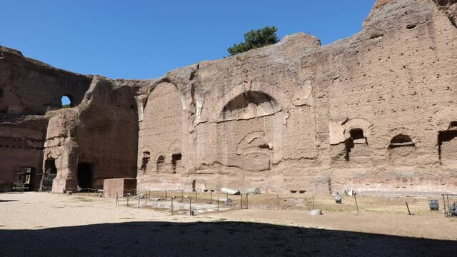 Baths of Caracalla ruins in city of Rome, Italy, ancient Roman public baths, built between AD 212 to 216 under direction of Marcus Aurelius (Emperor Caracalla), panning to the right