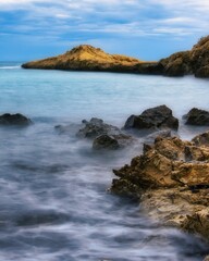 Fototapeta na wymiar Blue sea views at the LLop Mari beach, Campello, Alicante, Spain