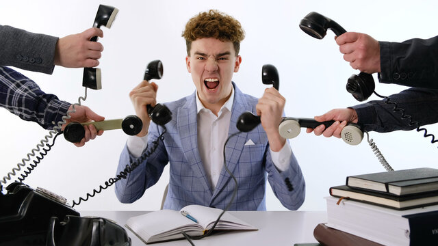 A lot of phone calls: Busy Angry assistant agent helper  working and answering a lot of calls at the same time, landline rotary phone. old school marketing or bad assistance concept