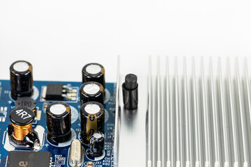 blue circuit board showing on board cooler and electronic components with copy space