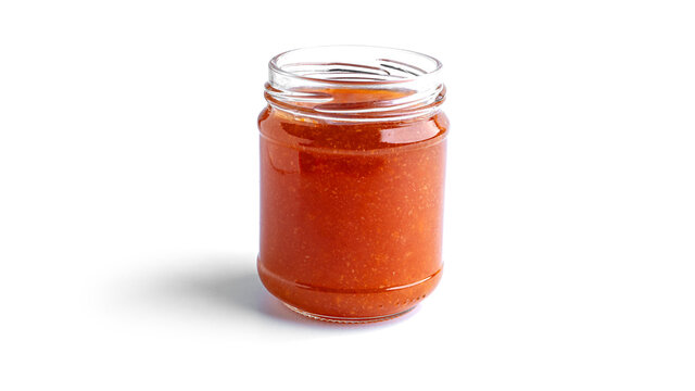 Orange jam in a glass isolated on a white background. High quality photo