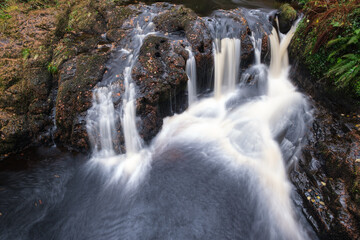Fototapeta premium Waterfall at Glenariff Forest Park, Northern Ireland, UK