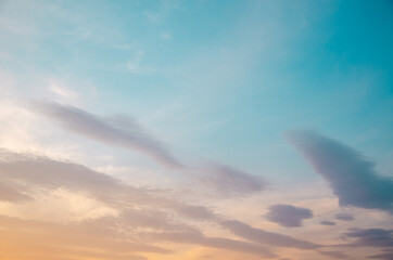 Naklejka na ściany i meble Colorful sky background with clouds at sunset