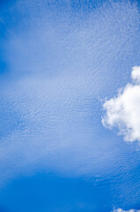 Blue sky background with abstract white clouds