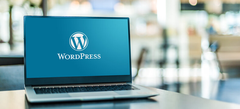 Laptop computer displaying logo of WordPress