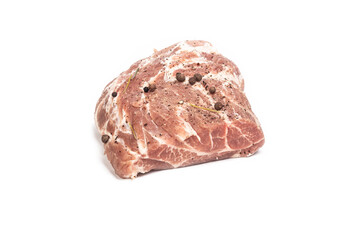 studio lighting. meat of a neck part of pork on a wooden cutting Board. On it seasoning, pepper. white background. Close-up