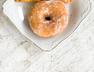 donut sugar on white plate.