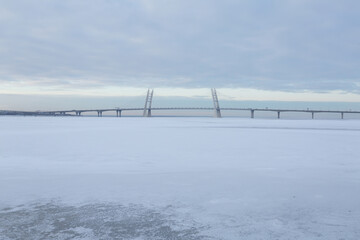 Picturesque winter sea view with the bridge.