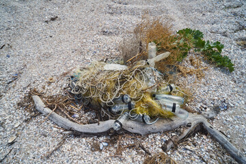 Plastic garbage dumped on the seashore.  Environmental pollution