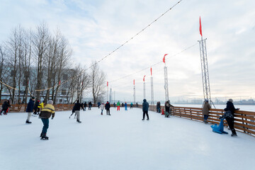 People skating on the icerink in Russia.