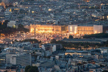 Fototapeta na wymiar Aerial view of Place de la Concorde in Paris at dusk with the city illuminated