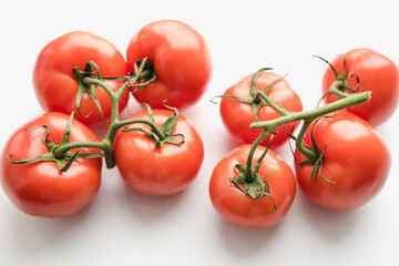Tomatoes on a white background, tomatoes with a sprig