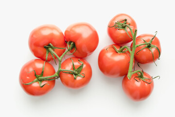 Tomatoes on a white background, tomatoes with a sprig