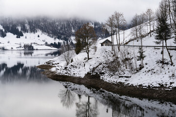 Beautiful winter landscapes along the shores of the Wagital lake in the idyllic pre-alps region of the Schwyz canton, Central Switzerland