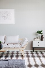 Scandinavian style living room interior with trendy sofa, wooden table and white shelf with vase