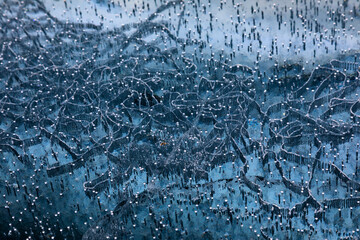 Blue ice surface with scratches on Baikal lake