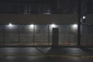 construction sidewalk in the city at night