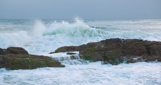 Waves Crashing at Snapper Rocks Gold Coast with Surfer Waiting in the Water