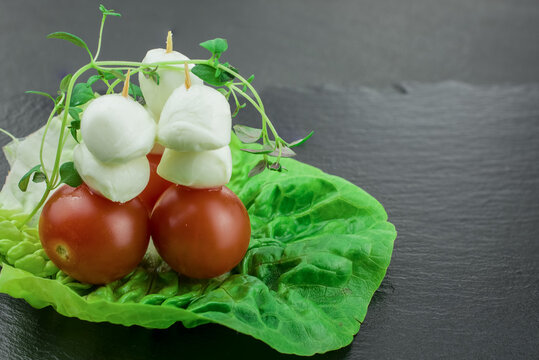 Delicious skewers of mazzarella cheese olives and tomatoes