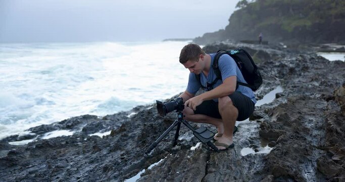 Photographer on Rocky Shore at Snapper Rocks Gold Coast Capturing Ocean Views