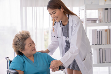 asian female doctor and senior patient at hospital