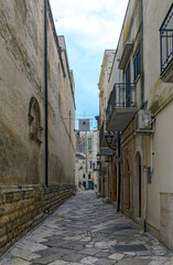 narrow old street at the historic part of Altamura, Italy