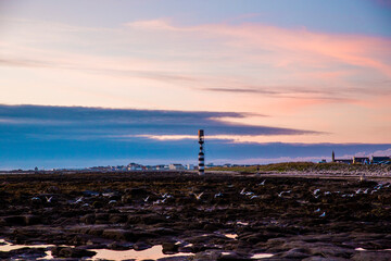 Obraz premium Coucher de soleil phare mer Bretagne Finistère