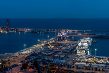 Fototapeta premium night urban landscape of the port of the city of Barcelona.