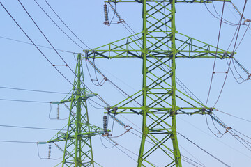 Electricity pole against blue sky clouds, Transmission line of electricity to rural, High voltage electricity pole on bright sky clouds background, electricity transmission pylon