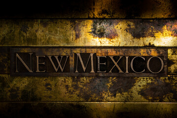 New Mexico text on textured grunge copper and vintage gold background